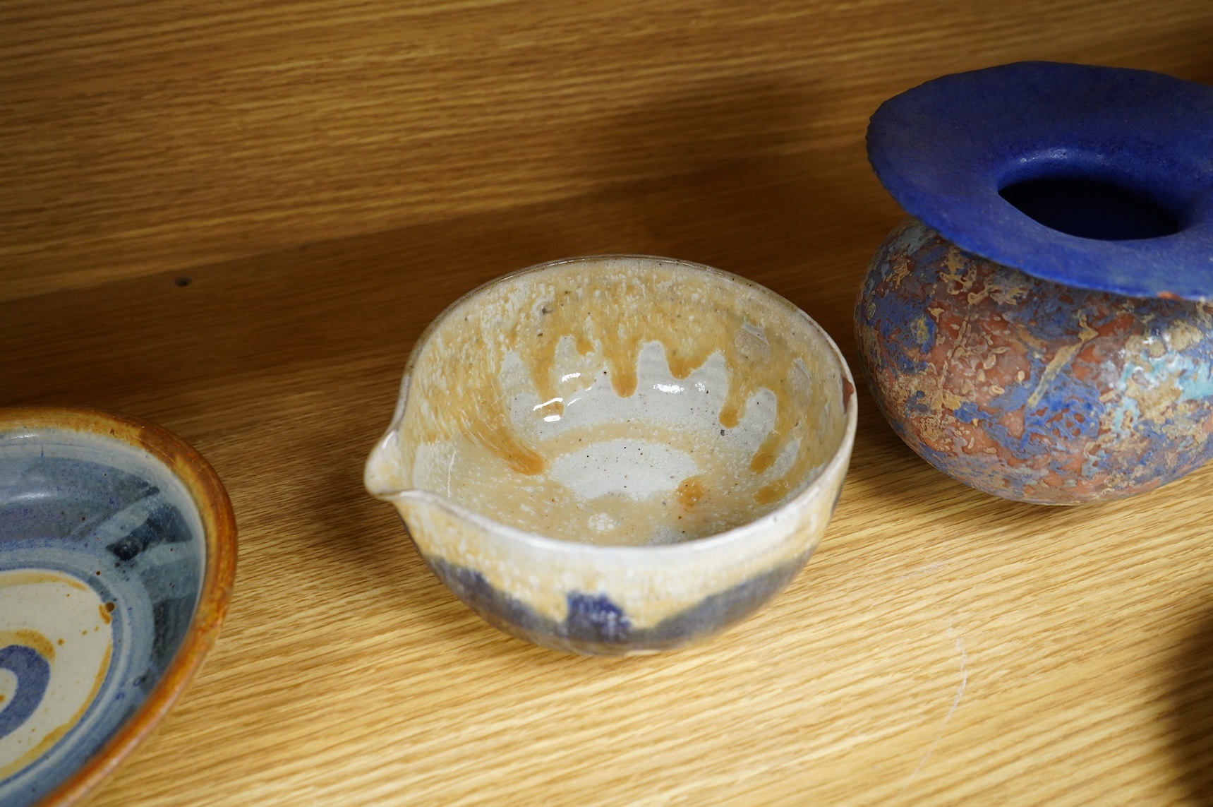 A collection of studio pottery to include crystalline glazed works by Stephen R Jones Des, Brighton, vases and a pair of dishes, largest 22cm high